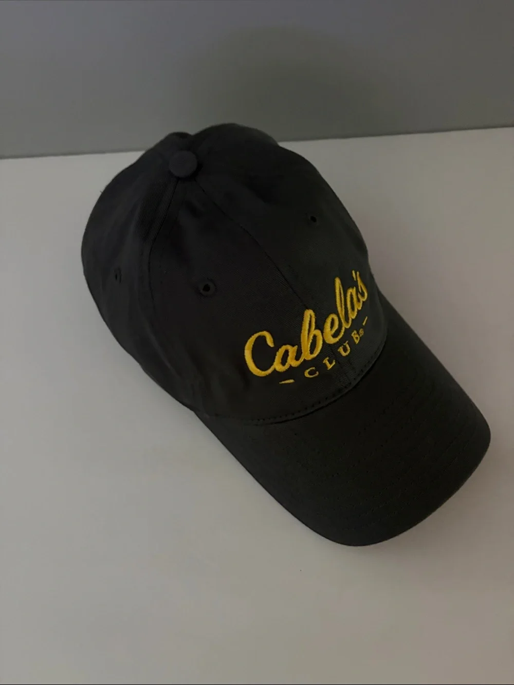 Cabela's Black Baseball Cap with Yellow Script Logo
